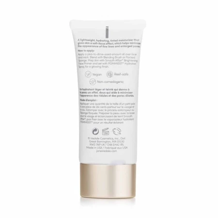 Tył opakowania JANE IREDALE Dream Tint Tinted Moisturizer to elegancka tubka z miękkiego plastiku w kolorze beżowym, z delikatnymi złotymi akcentami. Ma praktyczny otwór dozujący, umożliwiający łatwą aplikację. Pojemność to 40 ml.