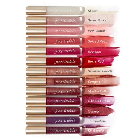 Na zdjęciu przedstawiona jest kolekcja błyszczyków do ust marki Jane Iredale, ułożona w formie próbników kolorystycznych. Każdy błyszczyk ma eleganckie, przezroczyste opakowanie z białą zakrętką i złotym akcentem.