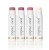 Na zdjęciu widoczne są cztery sztyfty pomadek ochronnych Jane Iredale. Produkty te mają eleganckie, białe opakowania z logo marki i złotym akcentem przy podstawie. Każdy ma inny odcień – od neutralnych beży i różów po klasyczny bezbarwny balsam.