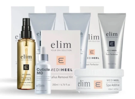 Zestaw profesjonalnych kosmetyków do pielęgnacji stóp marki Elim – widoczne tubki, butelki i słoiczek z serii MediHeel, m.in. AHA Foot Exfoliator, Foot Perfector, Spa Additive oraz Cuticle MD. Produkty ustawione w eleganckiej kompozycji.