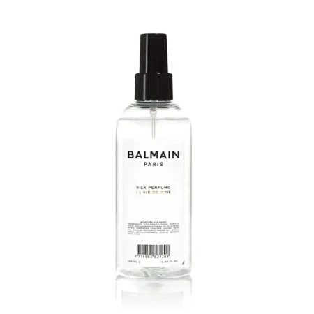 Perfumy do włosów Balmain Paris Silk Perfume w przezroczystej butelce z czarnym atomizerem. Minimalistyczny design z czarnym napisem na białym tle.