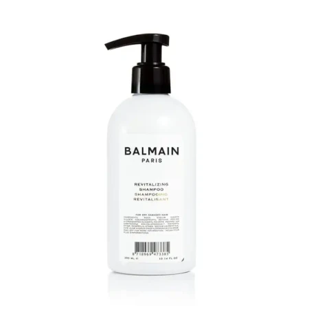 Balmain Paris Revitalizing Shampoo w białej butelce z czarną pompką, o pojemności 300 ml.