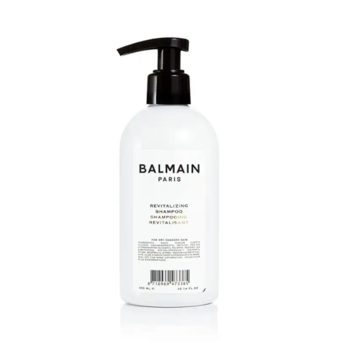 Balmain Paris Revitalizing Shampoo w białej butelce z czarną pompką, o pojemności 300 ml.