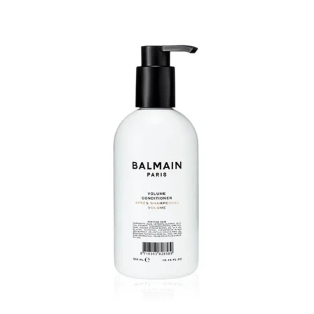 Odżywka do włosów Balmain Paris Volume Conditioner w białej butelce z czarną pompką. Minimalistyczny design, czarne litery na białym tle. Pojemność 300 ml.