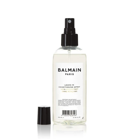 Przezroczysta butelka z czarnym atomizerem zawierająca odżywkę bez spłukiwania Balmain Paris Leave-In Conditioning Spray. Elegancki, minimalistyczny design. Produkt o pojemności 200 ml, z czarną zakrętką widoczną obok.