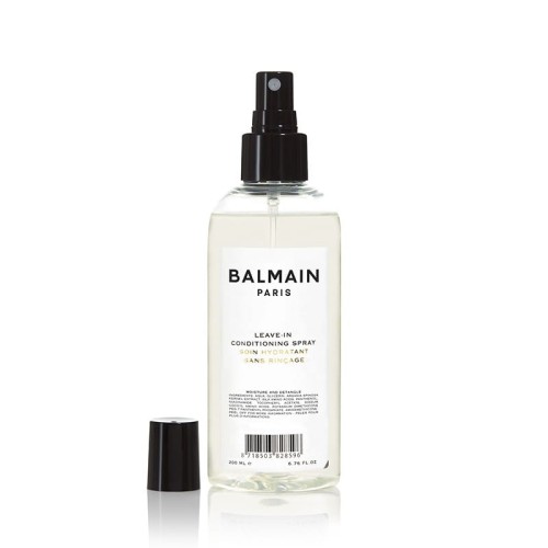 Przezroczysta butelka z czarnym atomizerem zawierająca odżywkę bez spłukiwania Balmain Paris Leave-In Conditioning Spray. Elegancki, minimalistyczny design. Produkt o pojemności 200 ml, z czarną zakrętką widoczną obok.