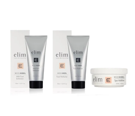 Trzy produkty Elim z linii MediHeel: AHA Foot Exfoliator, Foot Perfector (2 sztuki) i Spa Additive. Dwa z nich w tubkach ze srebrnym wykończeniem, jeden w białym słoiczku. Wszystkie ustawione na białym tle, z widocznymi opakowaniami kartonowymi.