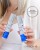 Kobieta trzymająca dwa produkty Environ z prestiżowej linii Youth EssentiA. Hasło „PEPTIDES. INTELLIGENTLY COMBINED” podkreśla synergiczne działanie obu produktów, które są zaprojektowane, aby wzajemnie się uzupełniać i zwiększać skuteczność.