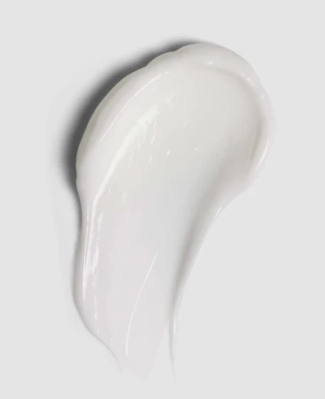 Na szarym, jednolitym tle widać zbliżenie na próbkę kosmetyku ENVIRON 3D Synerge Filler Creme, który jest w formie rozsmarowanej kropli białego kremu.