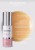Butelka żelu Environ Focus Care Comfort+ Colostrum Gel z pompką, w kolorze białym z metaliczną, srebrną nakrętką i biało-różową etykietą, obok butelki próbka żelu w kolorze pomarańczowym i wypisanymi składnikami aktywnymi.