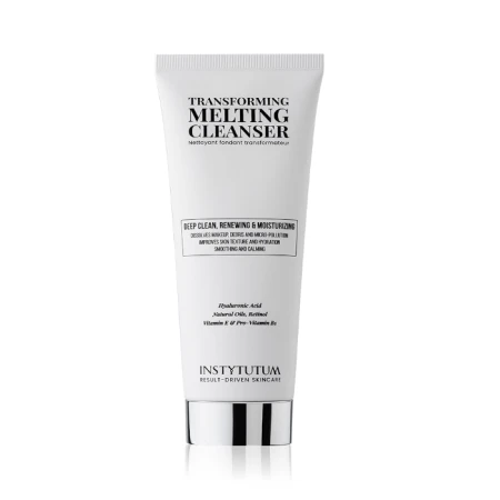 Biała tubka Instytutum Transforming Melting Cleanser z czarnym napisem i srebrnym elementem przy zamknięciu. Produkt oczyszczający, odnawiający i nawilżający, z kwasem hialuronowym, olejem migdałowym i witaminami. Design minimalistyczny.