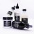 Pięć produktów do pielęgnacji włosów marki Davines z serii OI: szampon, odżywka, liquid luster, all in one milk i olejek; ustawione na jasnym tle, wszystkie z charakterystycznymi czarnymi etykietami.