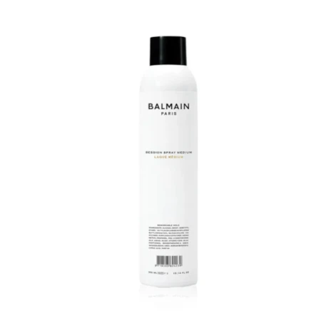 Biała butelka lakieru do włosów Balmain Paris Session Spray Medium z czarną nakrętką. Minimalistyczny design, czarne litery na białym tle