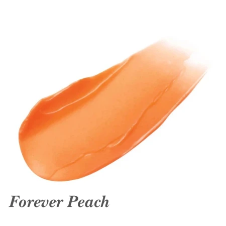Na zdjęciu widoczna jest próbka koloru produktu Jane Iredale Just Kissed Lip & Cheek Stain w odcieniu Forever Peach.  Kolor to ciepły, brzoskwiniowy odcień z subtelnym połyskiem