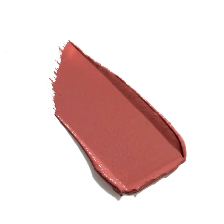 Na zdjęciu widzimy pomadkę Jane Iredale w odcieniu Rosebud. Odcień to ciepły zgaszony koral – połączenie przytłumionego różu z nutą brzoskwini i terakoty.