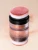 Na zdjęciu znajduje się INIKA Organic Mineral Baked Blush Puff Pot – naturalny, sypki róż do policzków zamknięty w eleganckim słoiczku z gąbeczką typu puff.