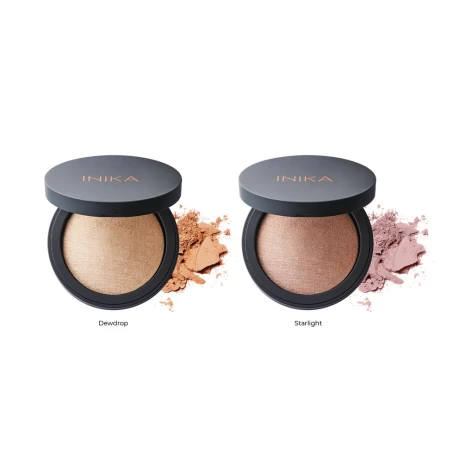 Na zdjęciu widoczne są dwa rozświetlacze INIKA Organic z serii Baked Illuminisor w odcieniach: Dewdrop–jasny, złocisty odcień, idealny dla ciepłych tonów. Starlight–chłodniejszy, różowo-perłowy odcień, odpowiedni dla jaśniejszych i neutralnych tonacji