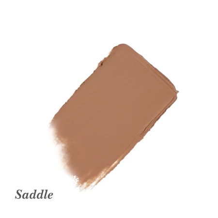 Na zdjęciu znajduje się próbka kremowego cienia do powiek w odcieniu Saddle marki jane iredale. Kolor ten to średni, rdzawy brąz o matowym wykończeniu. Idealny do modelowania załamania powieki, podkreślenia konturu oka