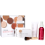 Na zdjęciu widzimy elegancki, zestaw kosmetyków w przy białym pudełku marki jane iredale. Widzimy puder, puderniczkę, spray, bazę i pędzel handi.