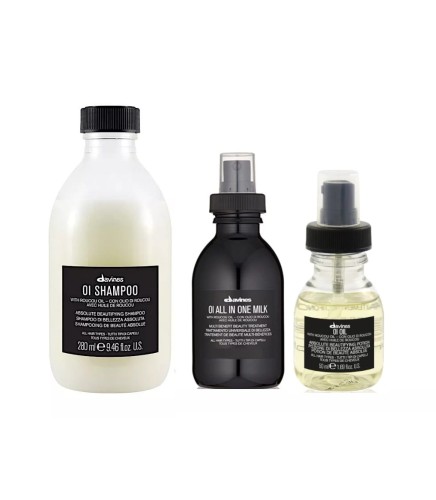 Trzy produkty z serii Davines OI ustawione obok siebie: szampon (260 ml), All In One Milk (mleczko wielofunkcyjne w sprayu) i olejek OI Oil w buteleczce z atomizerem.