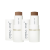 Na zdjęciu widzimy dwa wielofunkcyjne, kremowe, mineralne bronzery w sztyfcie tzw. stick; Glow Time Bronzer Stick marki Jane Iredale w odcieniu Schorch i Sizzle.