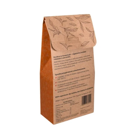 Pudełko herbaty SAROOBOS Rooibos Honeybush Tea. Opakowanie w kolorach białym i pomarańczowym z grafiką kwitnącej gałązki. Zawiera 20 torebek. Produkt bezkofeinowy, bogaty w antyoksydanty, w 100% naturalny.