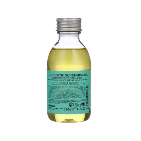 Butelka Davines Authentic Nourishing Oil 140 ml. Przezroczyste opakowanie ze srebrną zakrętką i zieloną etykietą zawiera złocisty olejek do włosów, twarzy i ciała.