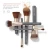 Na grafice widzimy kolekcję pędzli Jane Iredale  w spójnej, eleganckiej kolorystyce. Włosie ma ciepły kasztanowy brąz z delikatnym, naturalnym gradientem, skuwki: jasne złoto lub champagne gold, trzonki: matowy grafit.