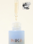 Na zdjęciu znajduje się buteleczka serum INIKA Organic Hyaluronic Hydration Complex w eleganckim, matowym, błękitnym odcieniu. Z pipety widocznej nad otwartą butelką wypływa przejrzysty płyn, co sugeruje lekką, nawilżającą formułę produktu.