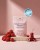 Różowe opakowanie Female Hormone Support marki Rejuvenated na jasnoróżowym tle, na kamiennej podstawie. Obok truskawki i wiśnie. Widoczna plakietka nagrody Beauty Wellbeing Awards 2026 Winner.jpg