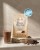 Beżowe opakowanie odżywki Protein Smoothie Chocolate marki Rejuvenated, obok szklanka napoju czekoladowego i kawałki czekolady; widoczne oznaczenie nagrody Beauty Shortlist Wellbeing Awards 2026 – Editor’s Choice.jpg