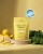 Żółte opakowanie Cellular Calm Complex marki Rejuvenated na żółtym tle. Stoi na drewnianej podstawie, obok cytryny i zielone liście. Widoczna plakietka nagrody Beauty Wellbeing Awards 2026 Winner.jpg