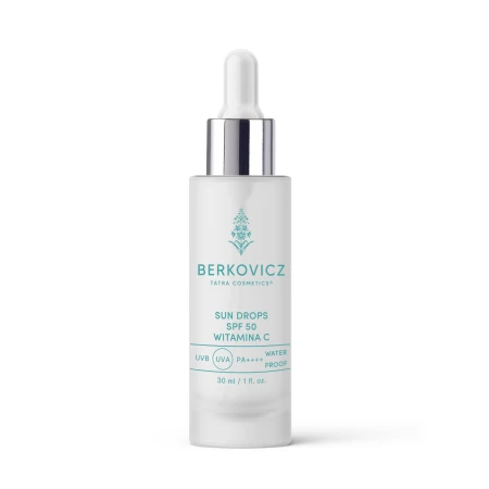 Minimalistyczne ujęcie produktu Berkovicz Tatra Cosmetics – Sun Drops SPF 50 Witamina C na jasnym tle. Białe, eleganckie opakowanie z pipetą i metalicznym wykończeniem