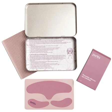 Zestaw Purles Reusable Silicone Eye Patches Na zdjęciu. Eleganckie, metalowe pudełko z instrukcją użytkowania, różowe opakowanie zewnętrzne oraz komplet silikonowych płatków: dwa pod oczy i jeden na okolice czoła. Delikatna, pudrowa kolorystyka.