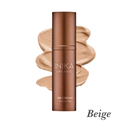 Na zdjęciu widoczny jest krem BB INIKA Organic BB Cream Prickly Pear w odcieniu Beige, przedstawiony na tle rozprowadzonego produktu, który podkreśla jego średni beżowy kolor oraz lekką, kremową formułę.
