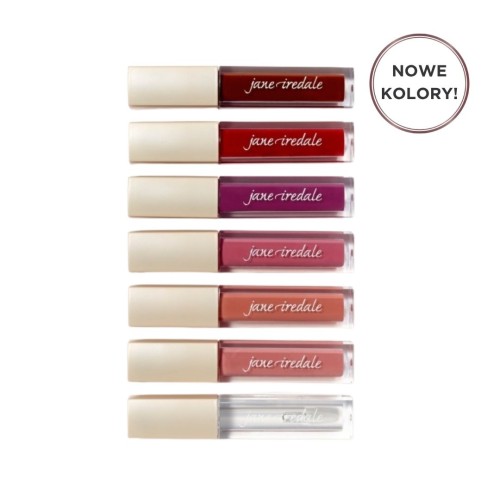 Na zdjęciu znajduje się zestaw błyszczyków marki Jane Iredale. Produkty ułożone są pionowo, jeden nad drugim, w eleganckich opakowaniach z beżową nakrętką i przezroczystym korpusem, przez który widać kolor błyszczyka.
