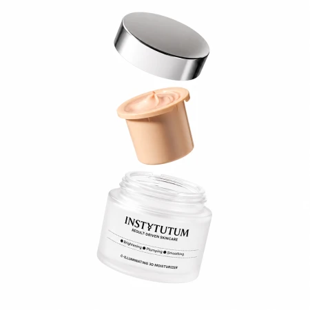 Grafika przedstawia system wymiennego wkładu kremu INSTYTUTUM C-Illuminating 3D Moisturizer. Nad otwartym słoiczkiem unoszą się brzoskwiniowy wkład z kremem oraz srebrna nakrętka.